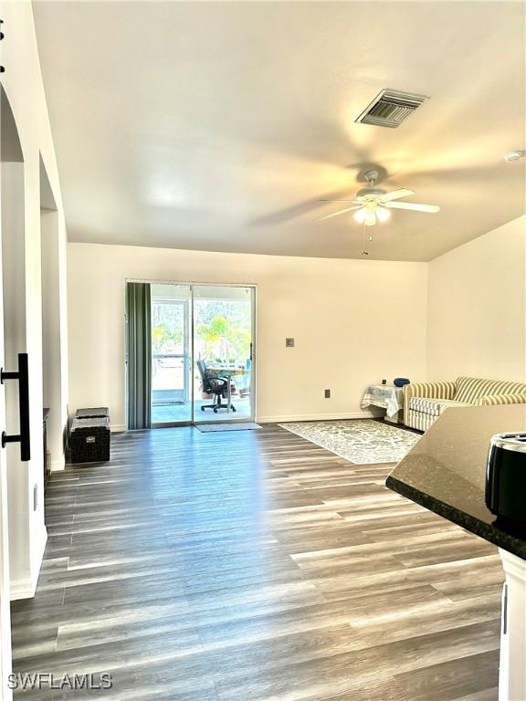 2675 70th Ave NE, Naples, FL 34120 - living room featuring ceiling fan and wood finished floors