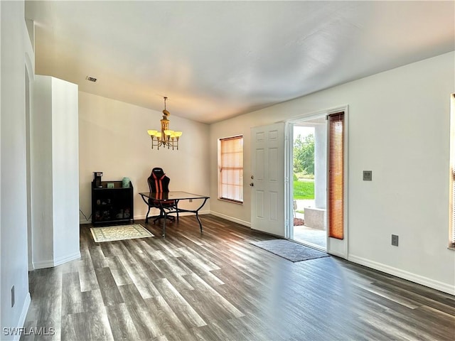 2675 70th Ave NE, Naples, FL 34120 - entrance foyer featuring dark wood-style flooring and a chandelier