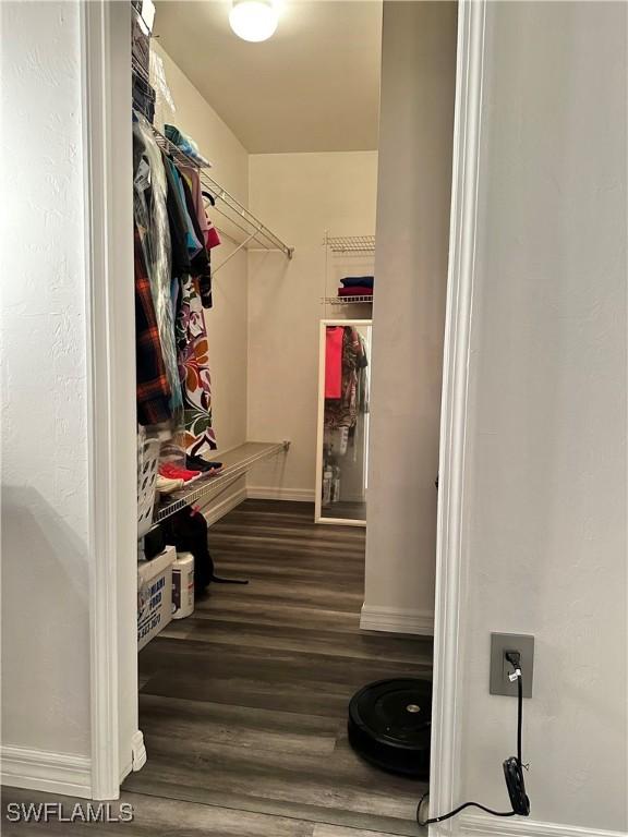 2675 70th Ave NE, Naples, FL 34120 - spacious closet featuring wood finished floors