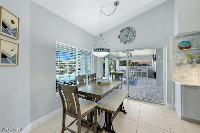 4404 SW 5th Ave, Cape Coral, FL 33914 - dining space with high vaulted ceiling and light tile patterned floors