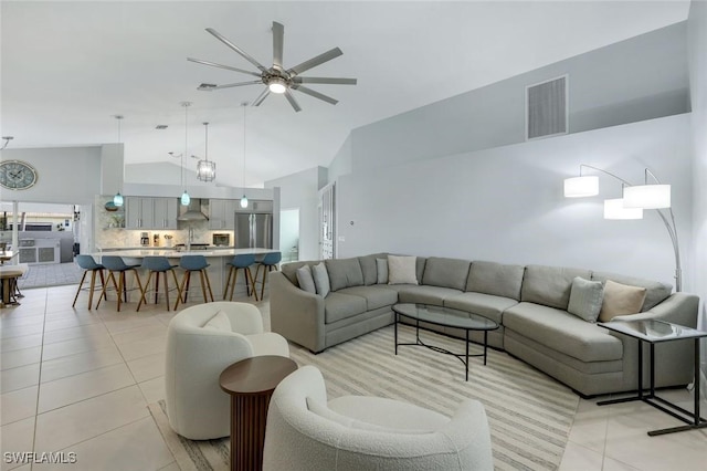 4404 SW 5th Ave, Cape Coral, FL 33914 - living room featuring light tile patterned floors, ceiling fan, and high vaulted ceiling