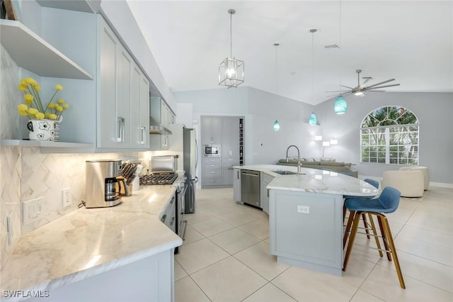 4404 SW 5th Ave, Cape Coral, FL 33914 - kitchen with stainless steel appliances, backsplash, lofted ceiling, open floor plan, and open shelves