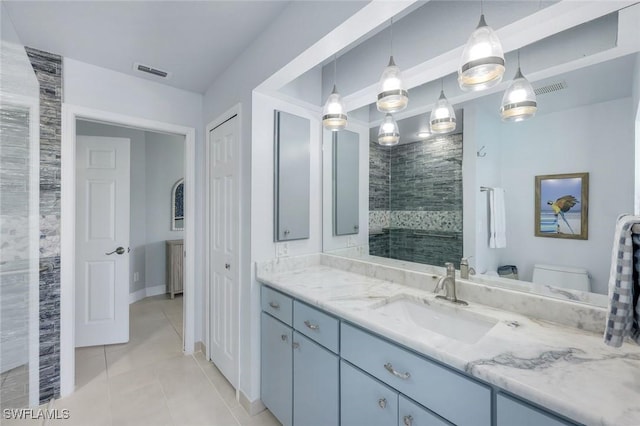 4404 SW 5th Ave, Cape Coral, FL 33914 - bathroom with vanity, tile patterned flooring, and a tile shower