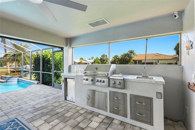 4404 SW 5th Ave, Cape Coral, FL 33914 - view of patio featuring exterior kitchen, a lanai, and an outdoor pool
