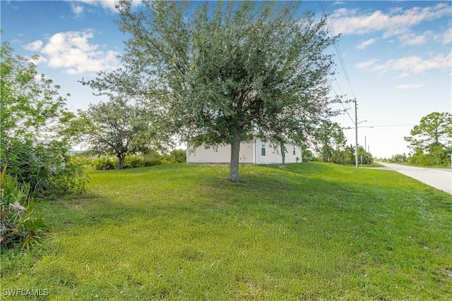 2818 66th St W, Lehigh Acres, FL 33971 - view of grassy yard
