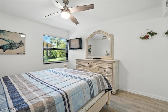 1506 Mainsail Dr Unit 1, Naples, FL 34114 - bedroom with light wood-style floors, ornamental molding, and ceiling fan