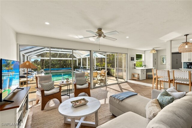 486 Lake Murex Cir, Sanibel, FL 33957 - living room with a sunroom, a ceiling fan, and recessed lighting