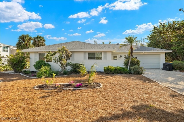 486 Lake Murex Cir, Sanibel, FL 33957 - ranch-style house with driveway, an attached garage, and stucco siding