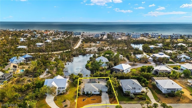 486 Lake Murex Cir, Sanibel, FL 33957 - aerial perspective of suburban area with a large body of water and property boundaries highlighted