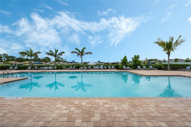 374 Deauville Loop, Naples, FL 34114 - community pool featuring a patio area