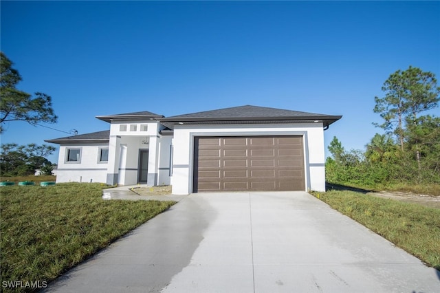 1268 Hillcrest St E, Lehigh Acres, FL 33974 - prairie-style home featuring stucco siding, an attached garage, concrete driveway, and a shingled roof