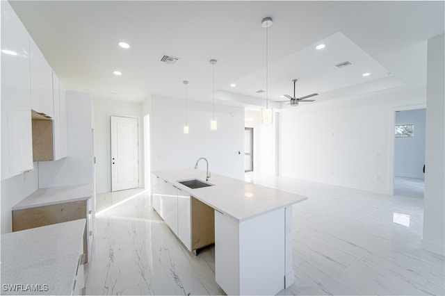 1268 Hillcrest St E, Lehigh Acres, FL 33974 - kitchen featuring recessed lighting, modern cabinets, white cabinetry, an island with sink, and decorative light fixtures