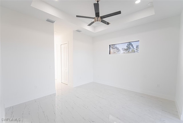 1268 Hillcrest St E, Lehigh Acres, FL 33974 - spare room with a tray ceiling, ceiling fan, and recessed lighting