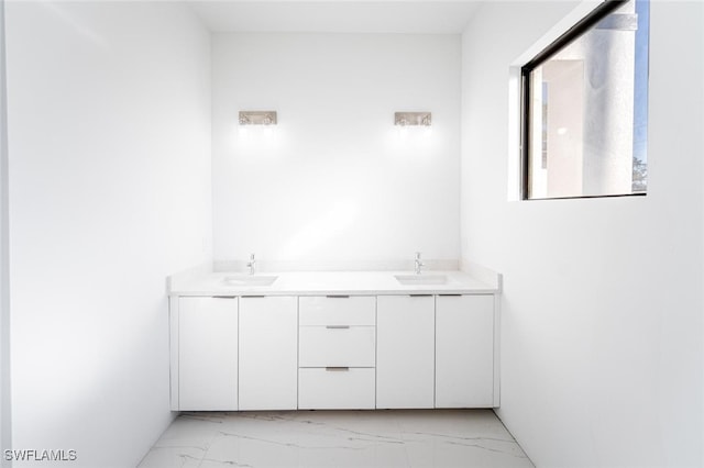 1268 Hillcrest St E, Lehigh Acres, FL 33974 - bathroom with marble look tile flooring and double vanity
