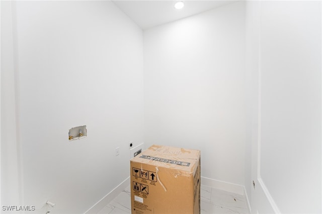 1268 Hillcrest St E, Lehigh Acres, FL 33974 - laundry room featuring electric dryer hookup, light marble finish flooring, hookup for a washing machine, and recessed lighting