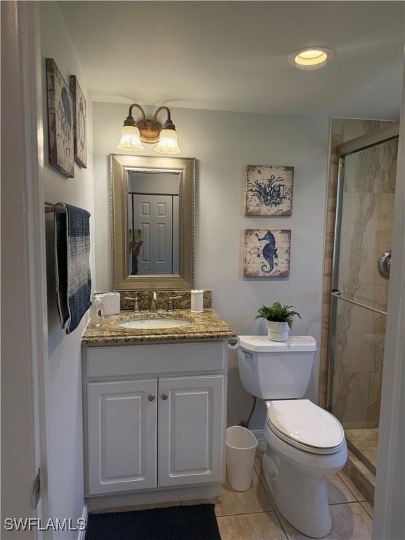 240 N Collier Blvd Unit A3, Marco Island, FL 34145 - full bath with vanity, a stall shower, and tile patterned floors