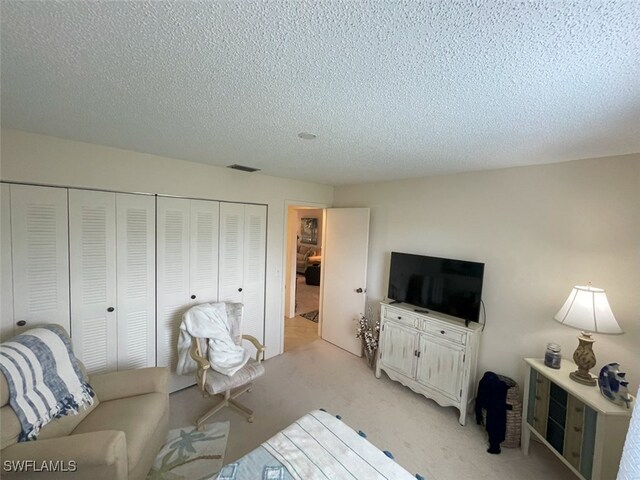 6300 S Pointe Blvd Unit 459, Fort Myers, FL 33919 - living area with light carpet and a textured ceiling