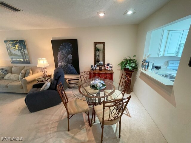 6300 S Pointe Blvd Unit 459, Fort Myers, FL 33919 - dining room featuring carpet and recessed lighting