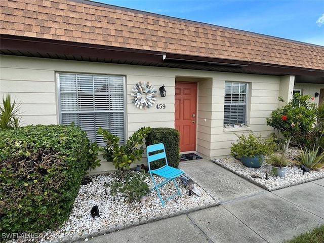 6300 S Pointe Blvd Unit 459, Fort Myers, FL 33919 - view of exterior entry featuring roof with shingles and mansard roof