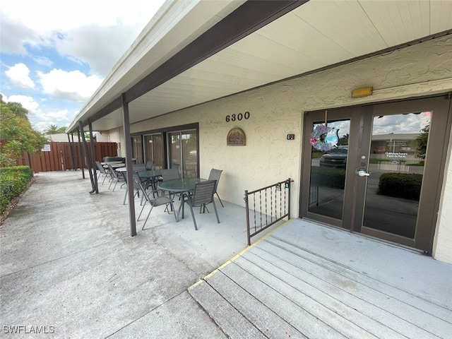 6300 S Pointe Blvd Unit 459, Fort Myers, FL 33919 - wooden terrace featuring outdoor dining area