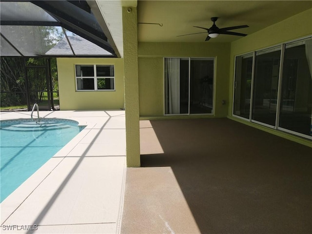 23447 Olde Meadowbrook Cir, Estero, FL 34134 - outdoor pool featuring a ceiling fan and a patio