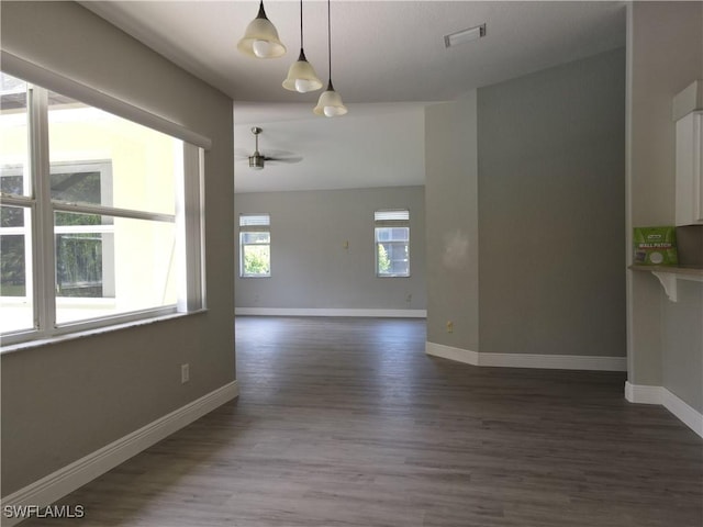23447 Olde Meadowbrook Cir, Estero, FL 34134 - unfurnished room featuring dark wood finished floors and a ceiling fan