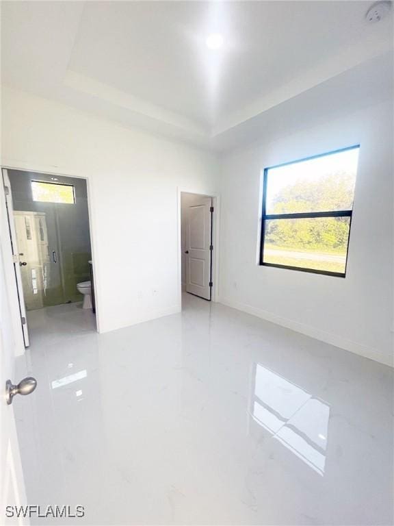 14121 Carlos St, Fort Myers, FL 33905 - spare room featuring plenty of natural light, a tray ceiling, and a smoke detector