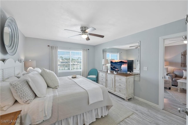 18068 San Carlos Blvd Unit 515, Fort Myers Beach, FL 33931 - bedroom featuring light wood-type flooring and ceiling fan