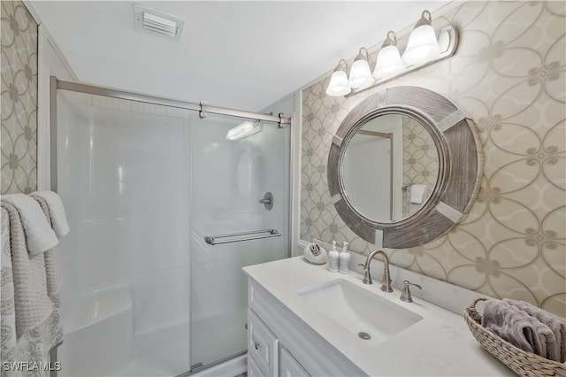 18068 San Carlos Blvd Unit 515, Fort Myers Beach, FL 33931 - full bath with wallpapered walls, an enclosed shower, and vanity