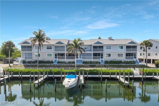 18068 San Carlos Blvd Unit 515, Fort Myers Beach, FL 33931 - rear view of property with a water view and boat lift