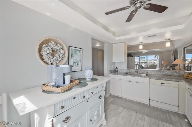 18068 San Carlos Blvd Unit 515, Fort Myers Beach, FL 33931 - kitchen featuring dishwasher, white cabinets, ceiling fan, light countertops, and a raised ceiling