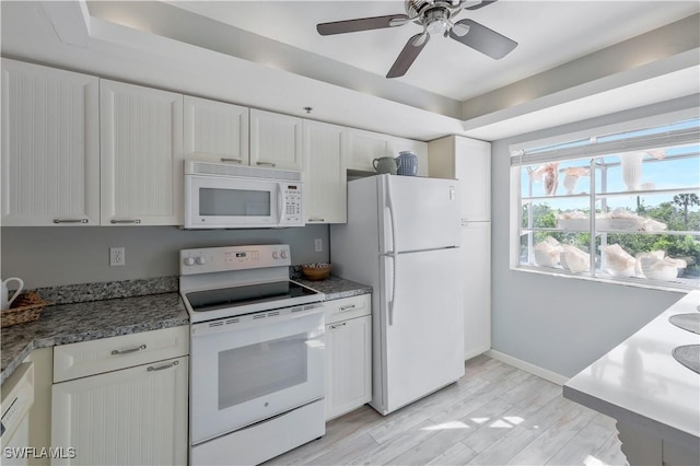 18068 San Carlos Blvd Unit 515, Fort Myers Beach, FL 33931 - kitchen with white appliances, white cabinetry, a ceiling fan, light wood finished floors, and a tray ceiling