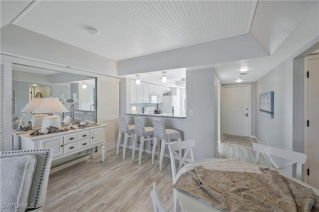 18068 San Carlos Blvd Unit 515, Fort Myers Beach, FL 33931 - dining space featuring light wood-type flooring and baseboards
