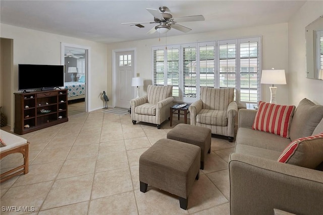 1721 Smugglers Cv, Naples, FL 34112 - living room featuring ceiling fan and light tile patterned floors