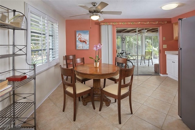 1721 Smugglers Cv, Naples, FL 34112 - dining space with a ceiling fan and light tile patterned floors