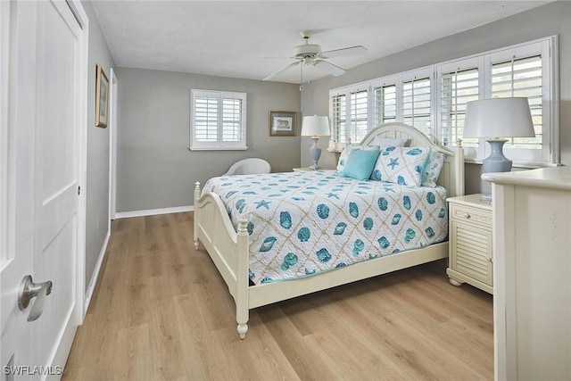 1721 Smugglers Cv, Naples, FL 34112 - bedroom featuring light wood-type flooring and ceiling fan