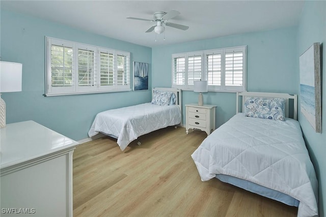 1721 Smugglers Cv, Naples, FL 34112 - bedroom with wood finished floors and a ceiling fan