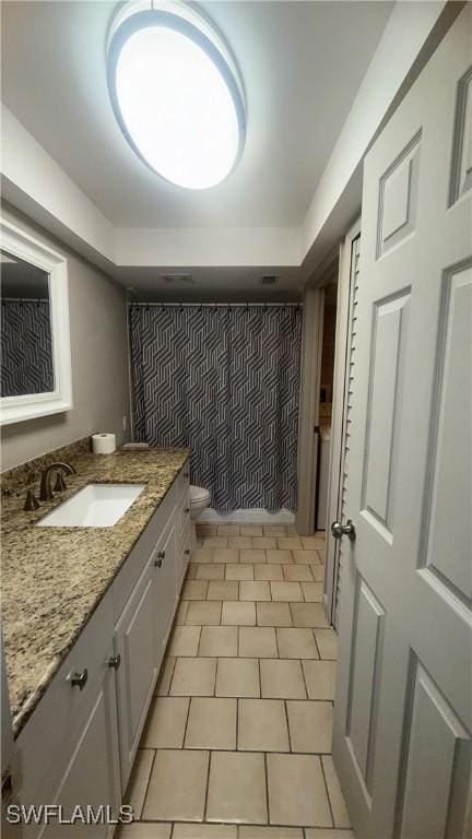 606 Gerald Ave Unit 115, Lehigh Acres, FL 33936 - full bathroom featuring vanity and an accent wall