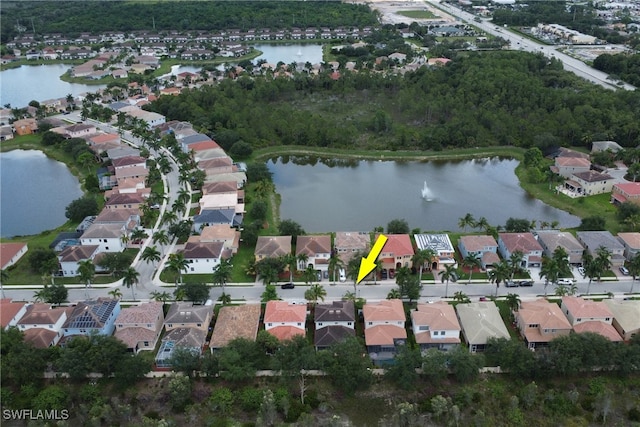 8677 Pegasus Dr, Lehigh Acres, FL 33971 - aerial view of property and surrounding area featuring nearby suburban area and a large body of water