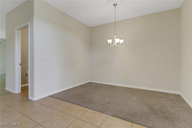8677 Pegasus Dr, Lehigh Acres, FL 33971 - spare room featuring a chandelier, light carpet, and light tile patterned flooring
