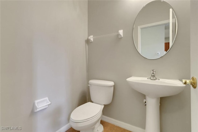 8677 Pegasus Dr, Lehigh Acres, FL 33971 - half bathroom featuring toilet and tile patterned flooring