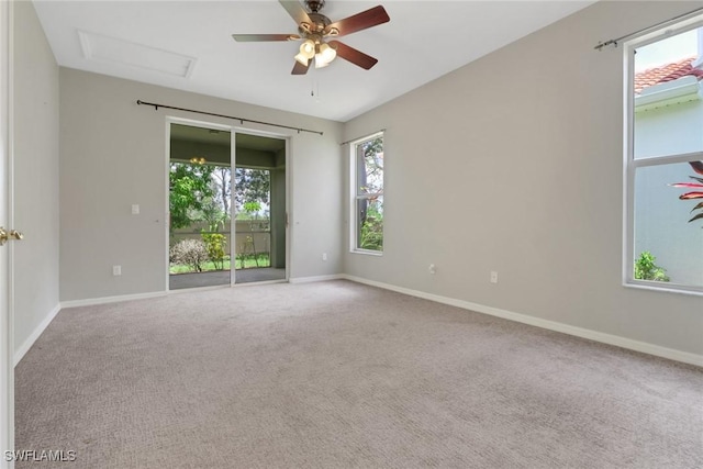 8677 Pegasus Dr, Lehigh Acres, FL 33971 - carpeted spare room featuring attic access and ceiling fan