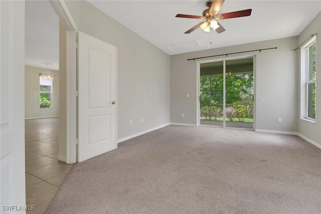 8677 Pegasus Dr, Lehigh Acres, FL 33971 - carpeted spare room featuring a ceiling fan and tile patterned flooring