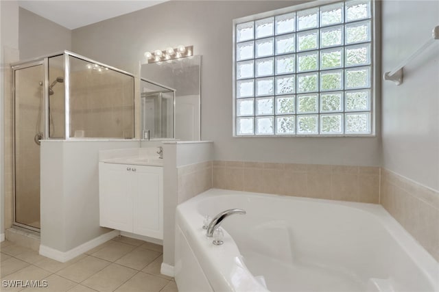 8677 Pegasus Dr, Lehigh Acres, FL 33971 - full bathroom featuring vanity, tile patterned floors, a shower stall, and a bath