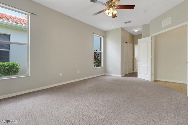 8677 Pegasus Dr, Lehigh Acres, FL 33971 - unfurnished bedroom with carpet and ceiling fan