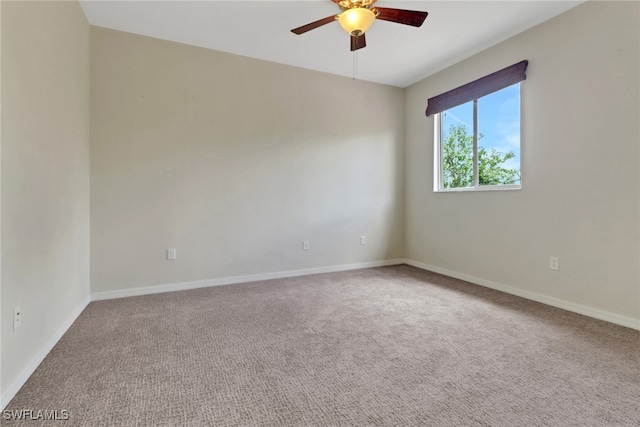 8677 Pegasus Dr, Lehigh Acres, FL 33971 - spare room with ceiling fan and carpet floors