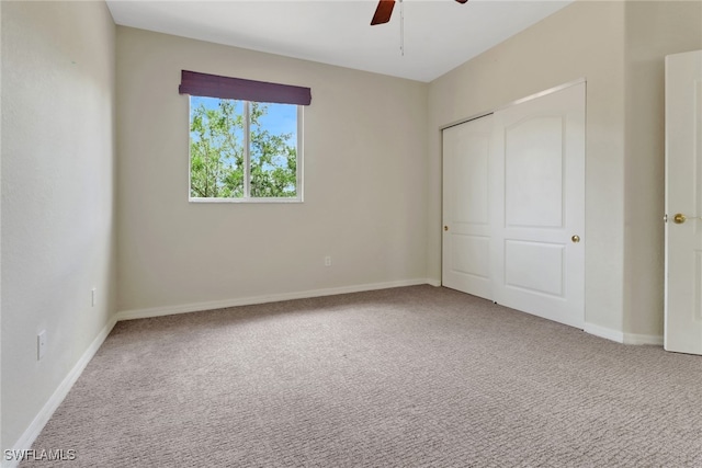 8677 Pegasus Dr, Lehigh Acres, FL 33971 - unfurnished bedroom with carpet floors, a closet, and ceiling fan