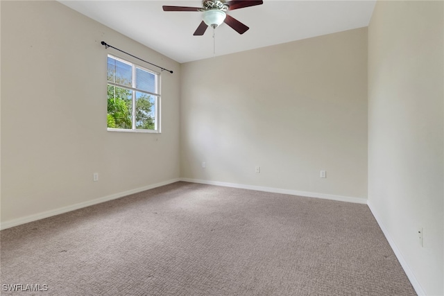 8677 Pegasus Dr, Lehigh Acres, FL 33971 - spare room featuring a ceiling fan and carpet