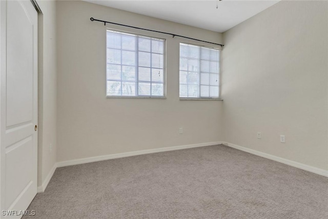 8677 Pegasus Dr, Lehigh Acres, FL 33971 - unfurnished bedroom with carpet floors and baseboards