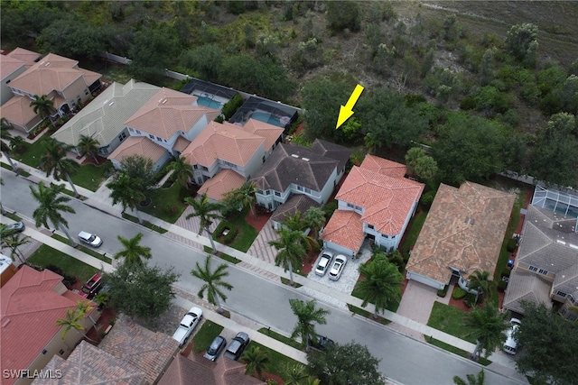 8677 Pegasus Dr, Lehigh Acres, FL 33971 - aerial view of property and surrounding area featuring nearby suburban area